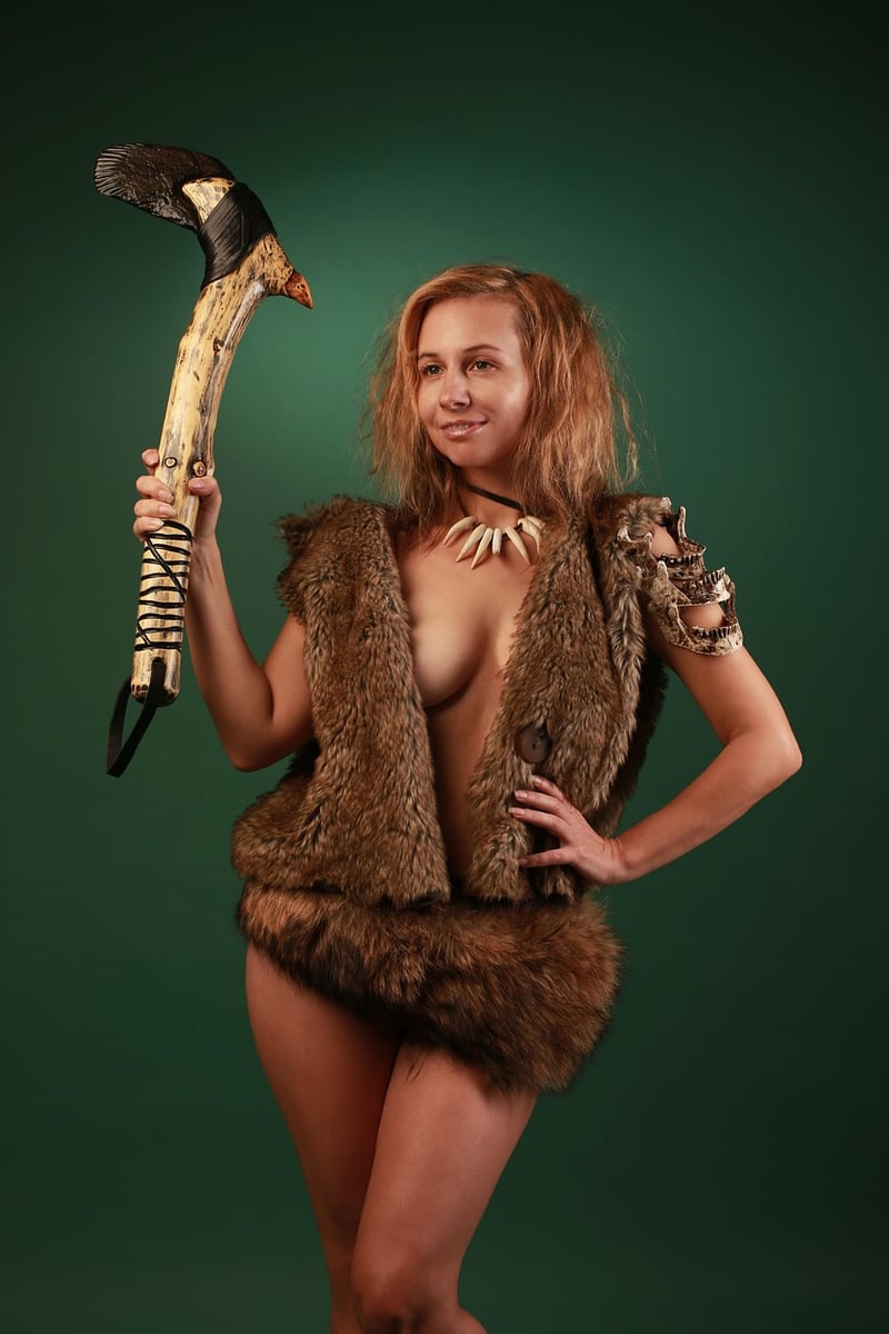 Prehistoric cave man with tools